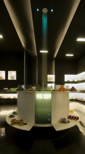 Vaso de agua central, chorro desde techo y expositores en Jabonería Glup Glup